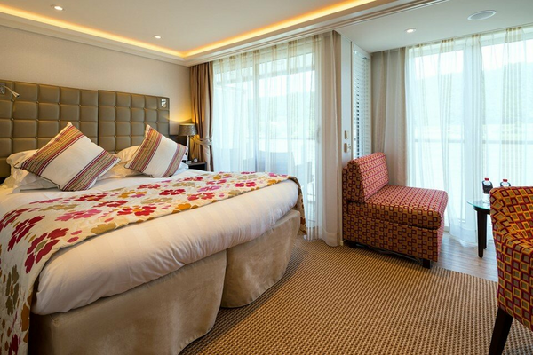 AmaWaterways AmaFiora Category AA Stateroom Bedroom WEB.png